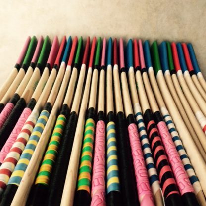 Coloured Kids Hurling Sticks